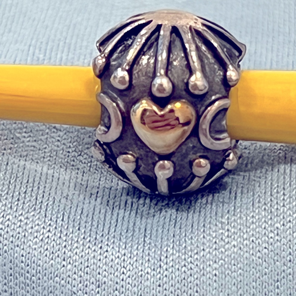Pandora hatched heart charm